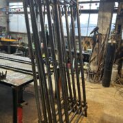 Steel rack frame in the manufacturing process - precise welding and machining.